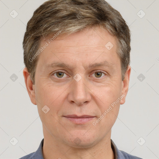 Joyful white adult male with short  brown hair and grey eyes