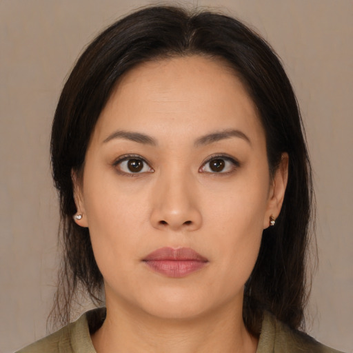 Neutral asian young-adult female with medium  brown hair and brown eyes