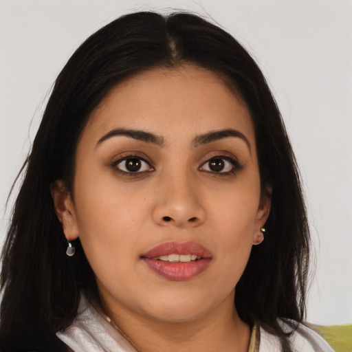 Joyful asian young-adult female with long  brown hair and brown eyes