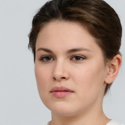 Neutral white young-adult female with short  brown hair and brown eyes