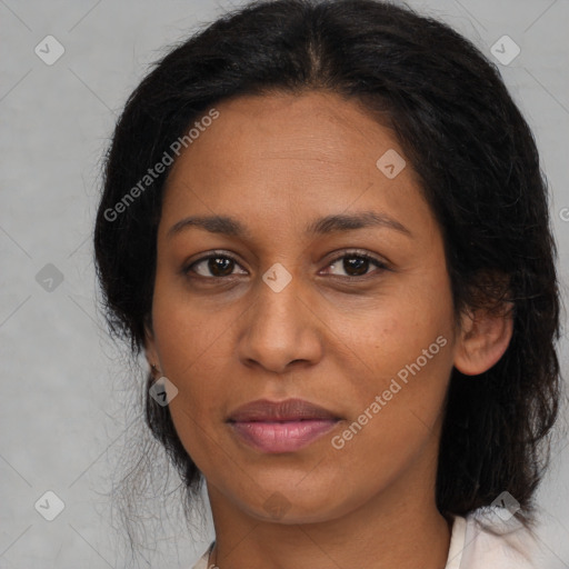 Joyful black adult female with medium  brown hair and brown eyes