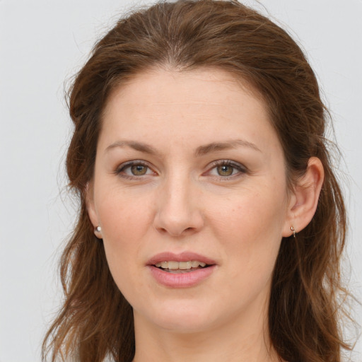 Joyful white young-adult female with long  brown hair and grey eyes