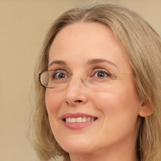 Joyful white adult female with long  brown hair and brown eyes