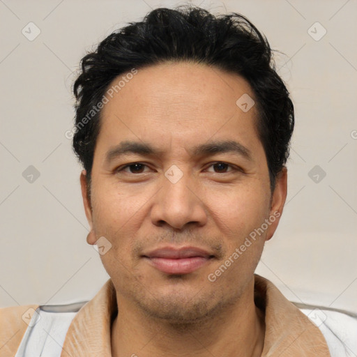 Joyful white adult male with short  black hair and brown eyes