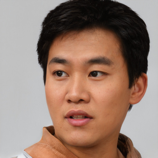 Neutral asian young-adult male with short  black hair and brown eyes