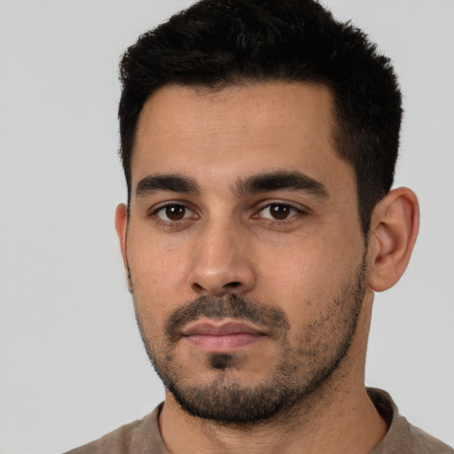 Neutral latino young-adult male with short  black hair and brown eyes