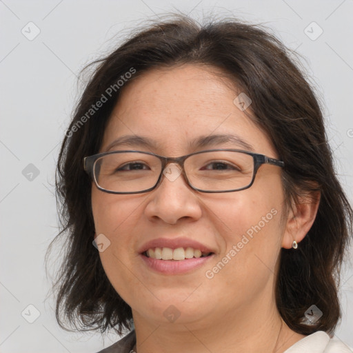 Joyful white adult female with medium  brown hair and brown eyes