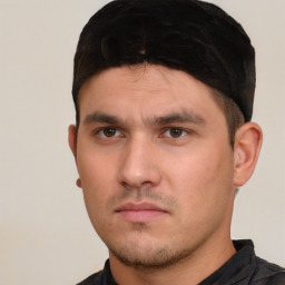 Neutral white young-adult male with short  black hair and brown eyes