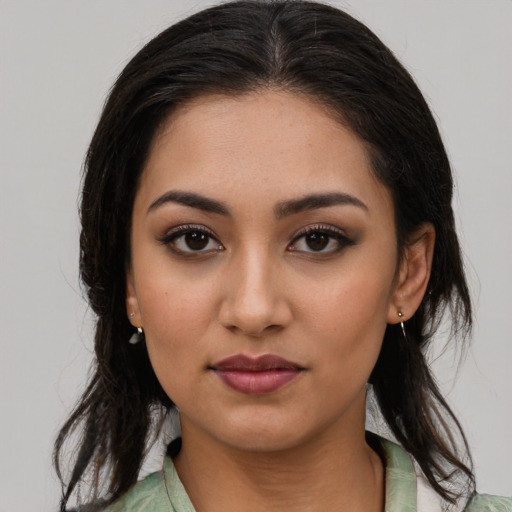 Neutral latino young-adult female with medium  brown hair and brown eyes