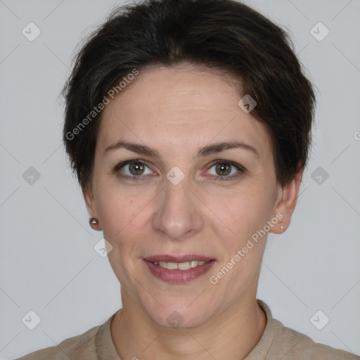 Joyful white adult female with short  brown hair and brown eyes