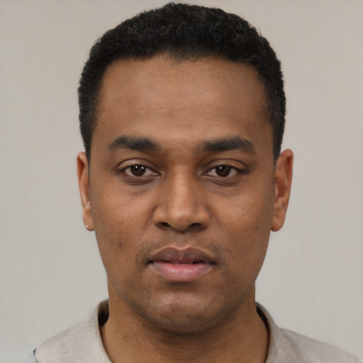 Neutral black young-adult male with short  black hair and brown eyes