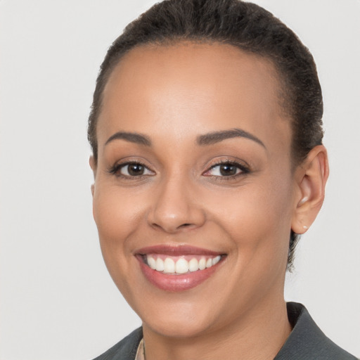 Joyful white young-adult female with short  brown hair and brown eyes