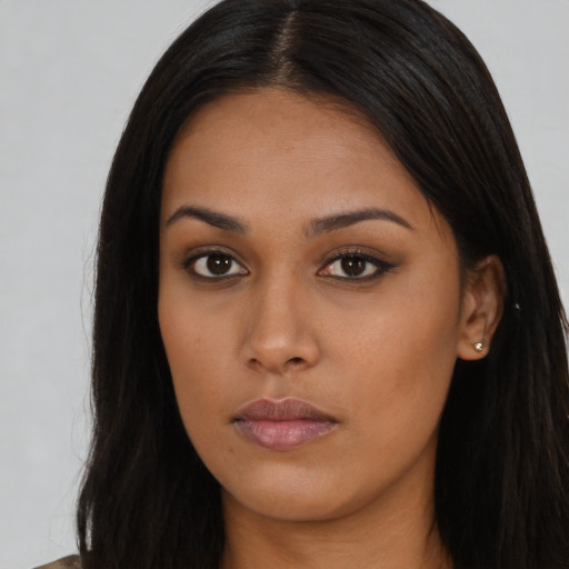 Neutral asian young-adult female with long  brown hair and brown eyes