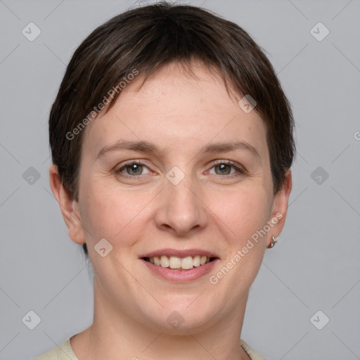 Joyful white young-adult female with short  brown hair and grey eyes