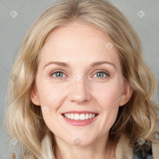 Joyful white adult female with medium  brown hair and blue eyes