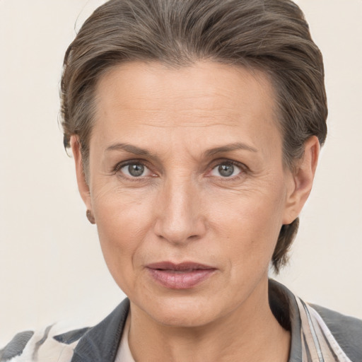 Joyful white adult female with short  brown hair and brown eyes