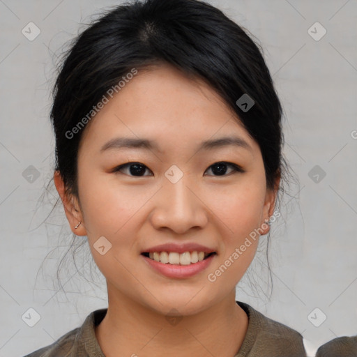 Joyful asian young-adult female with medium  black hair and brown eyes