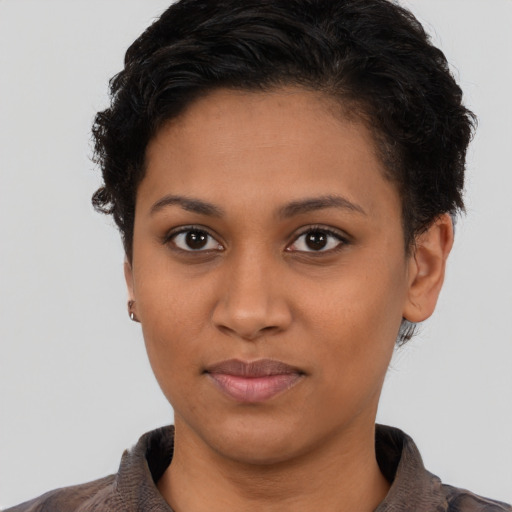 Joyful latino young-adult female with short  brown hair and brown eyes