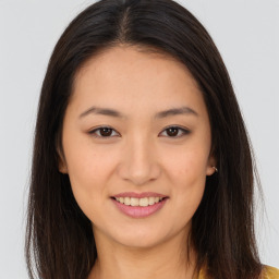 Joyful asian young-adult female with long  brown hair and brown eyes