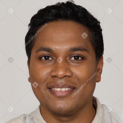 Joyful black young-adult male with short  black hair and brown eyes