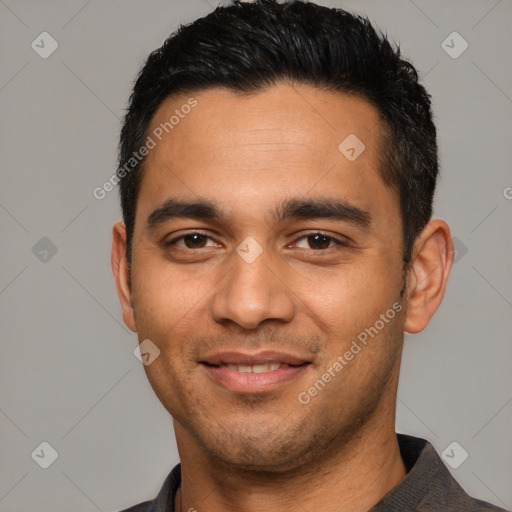 Joyful latino young-adult male with short  black hair and brown eyes