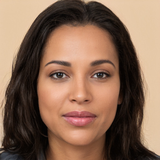 Joyful white young-adult female with long  brown hair and brown eyes