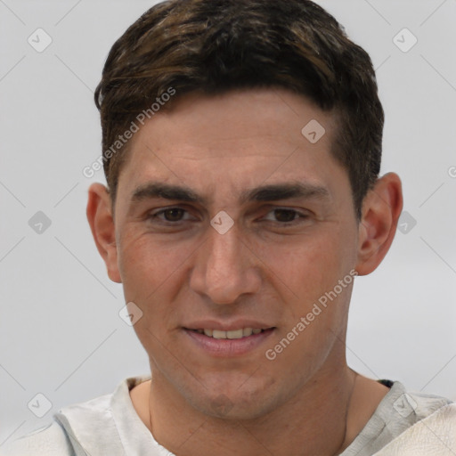 Joyful white adult male with short  brown hair and brown eyes