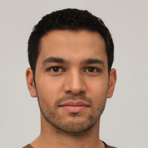 Neutral latino young-adult male with short  black hair and brown eyes