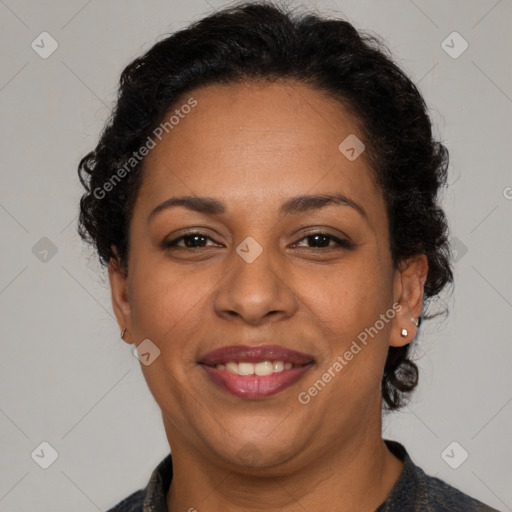 Joyful latino adult female with short  brown hair and brown eyes