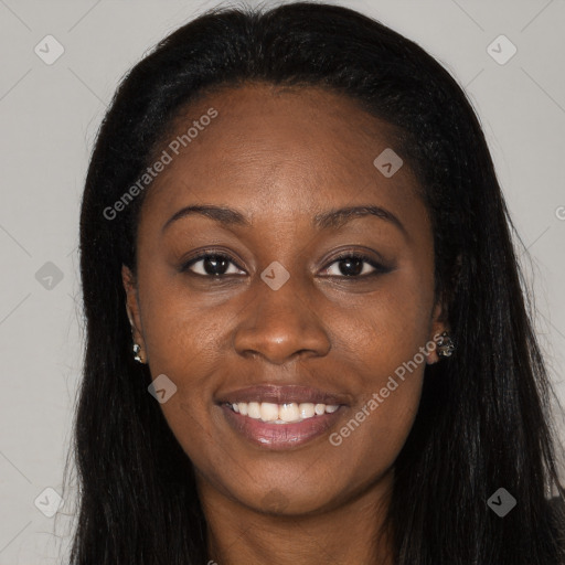 Joyful black young-adult female with long  black hair and brown eyes