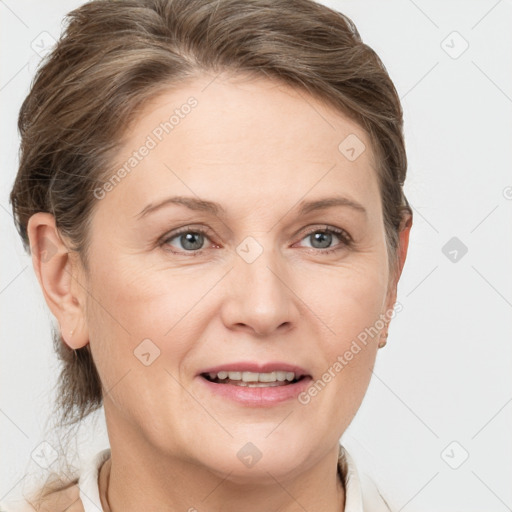 Joyful white adult female with short  brown hair and grey eyes