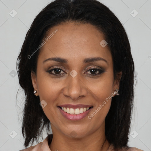 Joyful latino young-adult female with medium  brown hair and brown eyes