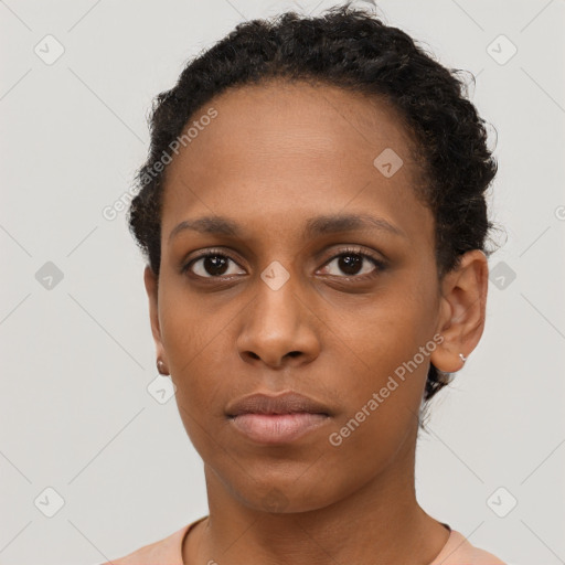 Neutral black young-adult female with short  brown hair and brown eyes