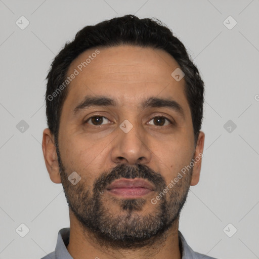 Neutral latino adult male with short  black hair and brown eyes