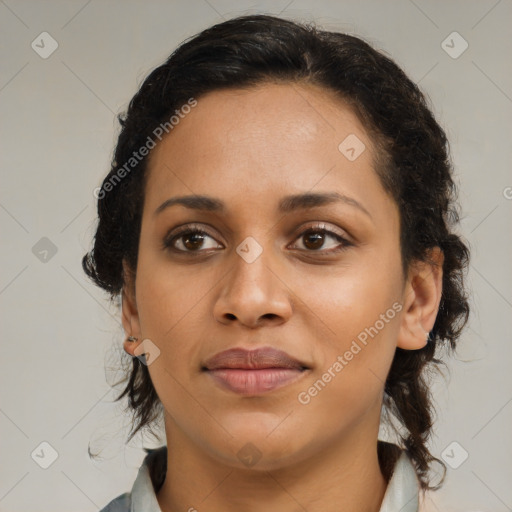 Joyful latino young-adult female with medium  brown hair and brown eyes