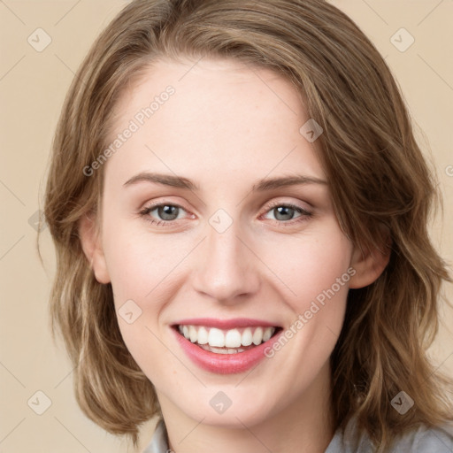 Joyful white young-adult female with medium  brown hair and green eyes