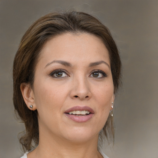 Joyful white young-adult female with medium  brown hair and brown eyes