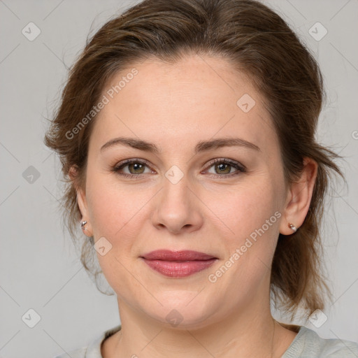 Joyful white young-adult female with medium  brown hair and green eyes