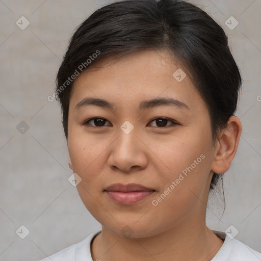 Joyful asian young-adult female with short  brown hair and brown eyes