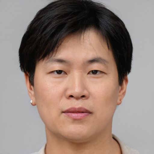 Neutral asian young-adult male with short  brown hair and brown eyes