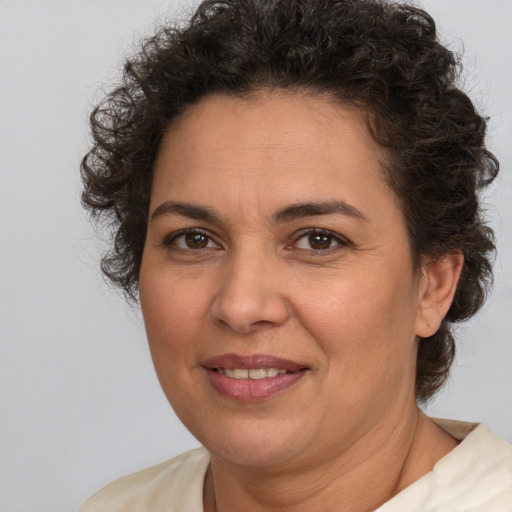 Joyful white adult female with short  brown hair and brown eyes