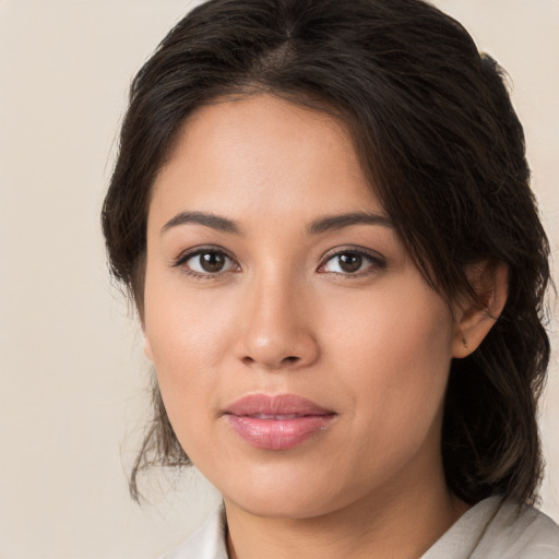 Joyful white young-adult female with medium  brown hair and brown eyes