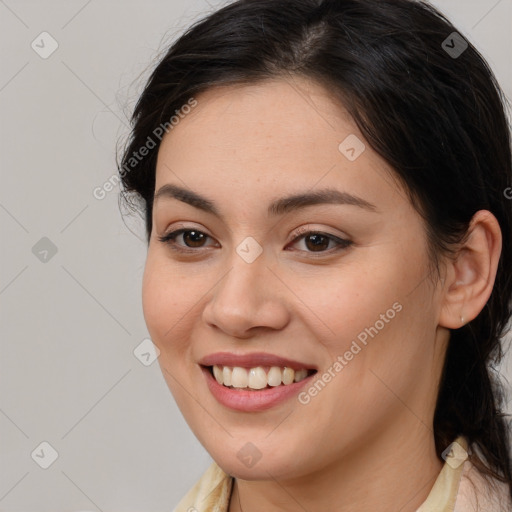 Joyful white young-adult female with long  brown hair and brown eyes