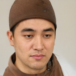 Neutral latino young-adult male with short  brown hair and brown eyes