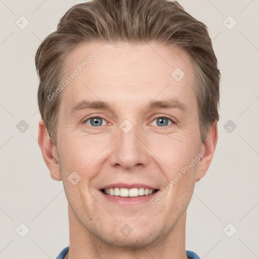 Joyful white adult male with short  brown hair and grey eyes