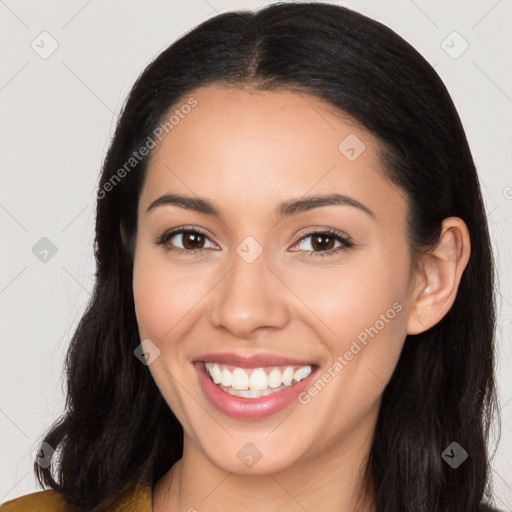 Joyful white young-adult female with long  black hair and brown eyes