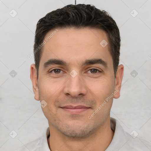 Joyful white young-adult male with short  brown hair and brown eyes