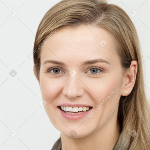 Joyful white young-adult female with long  brown hair and grey eyes