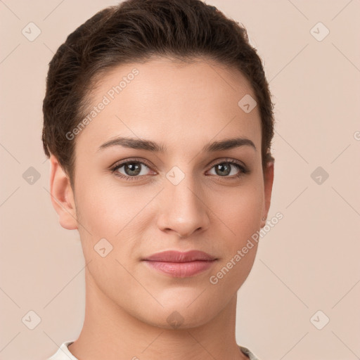 Joyful white young-adult female with short  brown hair and brown eyes