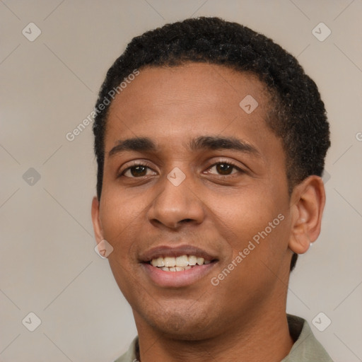 Joyful black young-adult male with short  black hair and brown eyes